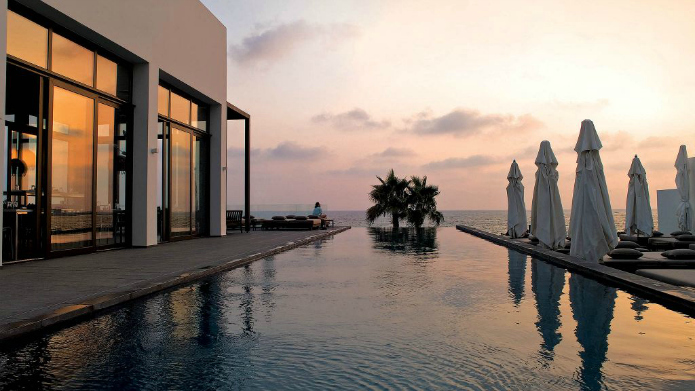 Almyra hanging pool at dusk