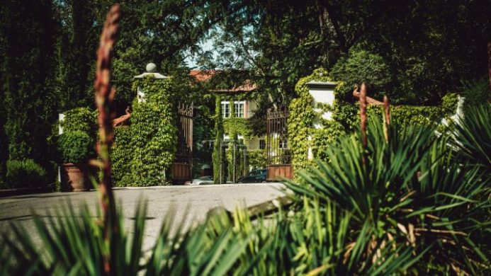 Castel Fragsburg hotel entrance gates with greenery