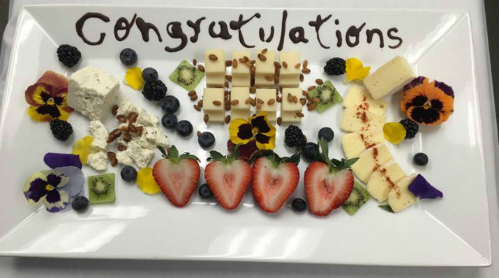 platter of welcome treats with congratulations written
