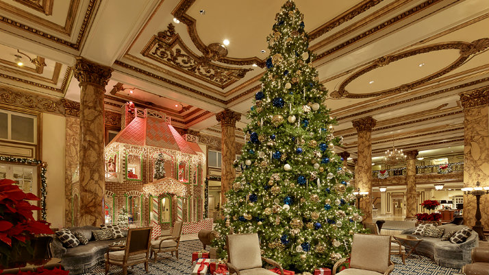 grand christmas tree in hotel lobby