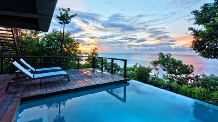 Infinity pool at sunset with ocean view