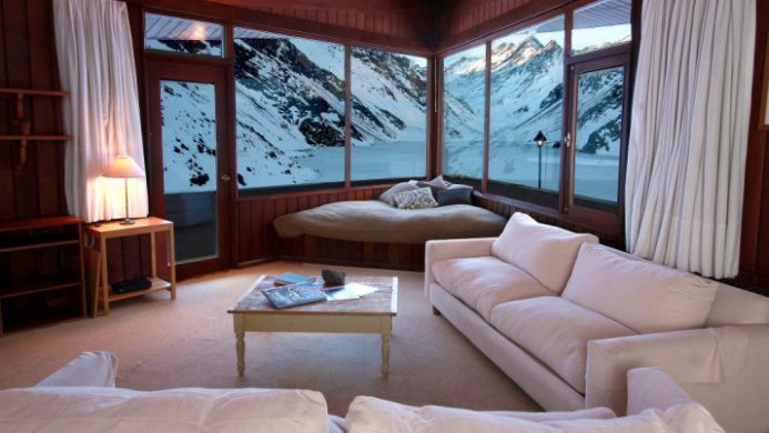 room with view of lake and mountains