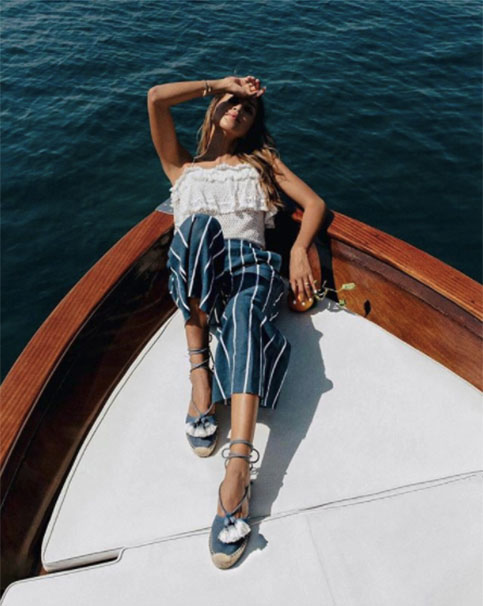 Sincerely Jules leaning back on a boat