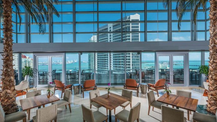 Conrad Miami lobby lounge with floor to ceiling windows and ocean view