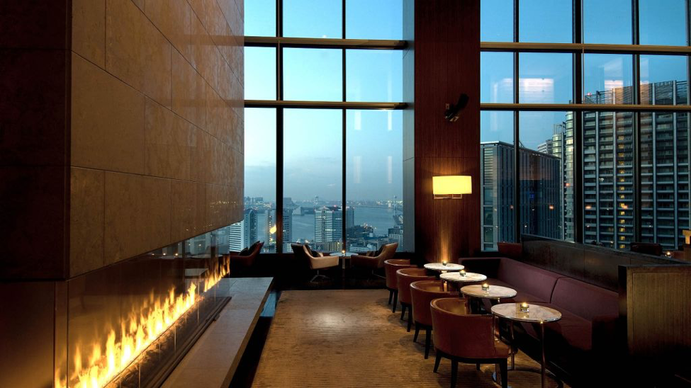 Conrad Tokyo Lobby with fireplace and large windows