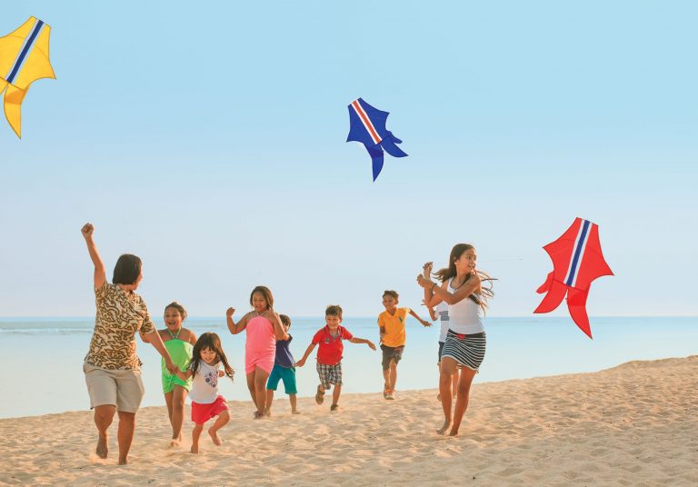 The Ritz-Carlton, Bali Kids Flying Kites on the Beach