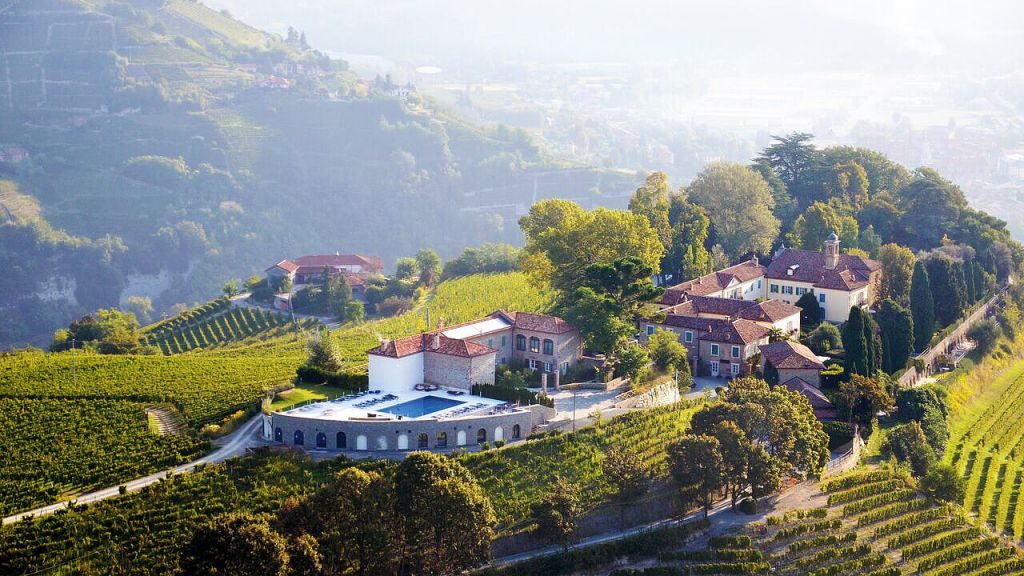 Relais San Maurizio hilltop village and hotel overlooking green mountains and valleys