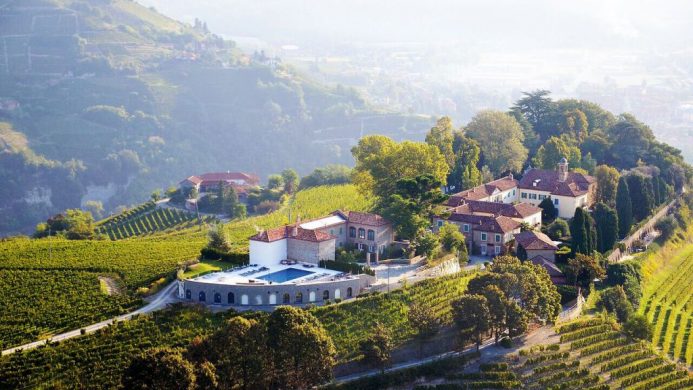 Relais San Maurizio hilltop village and hotel overlooking green mountains and valleys