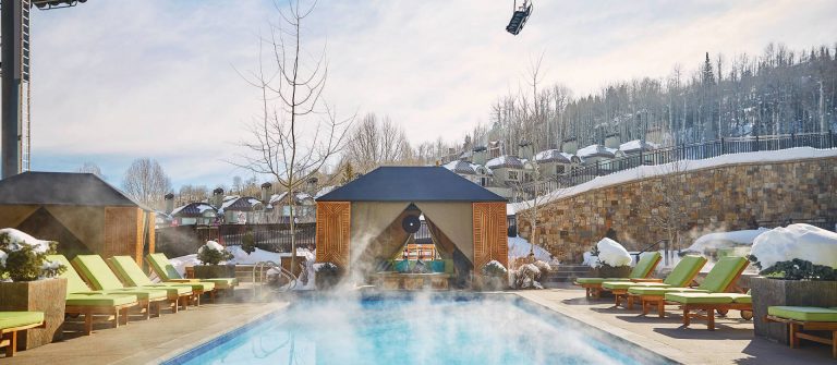 Viceroy Snowmass heated outdoor pool with snow background