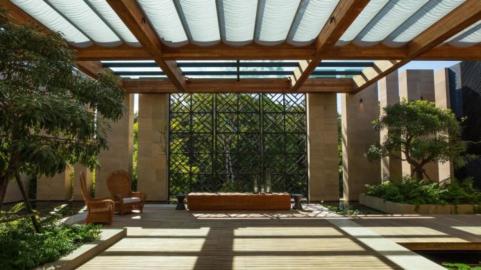 Rosewood Phuket indoor outdoor entryway surrounded by greenery