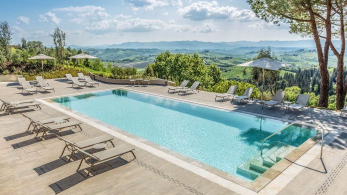 Il Castelfalfi outdoor pool patio overlooking Tuscan countryside