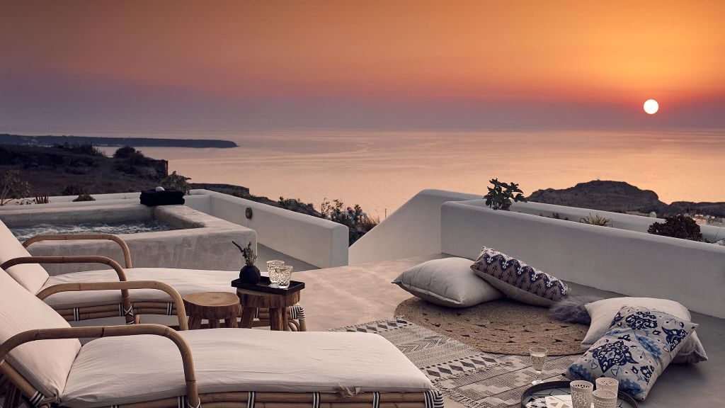 Santo Maris Oia Junior Suite terrace overlooking Aeagan Sea and fiery sunset