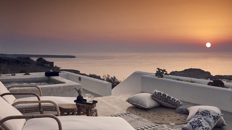Santo Maris Oia Junior Suite terrace with view of sunset and Aegan Sea