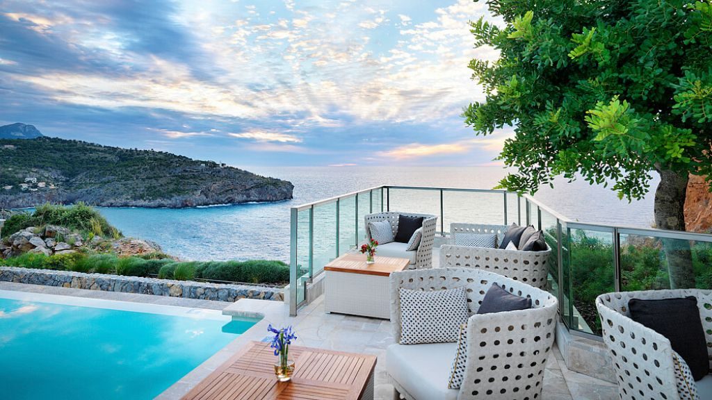 Jumeirah Port Soller Hotel & Spa infinity pool on cliff overlooking mountains and water