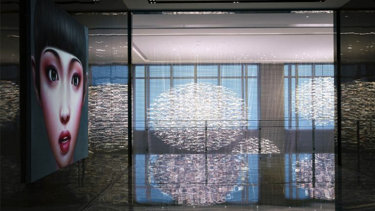 Niccolo Chongqing dim lobby with art fixtures and wall mural