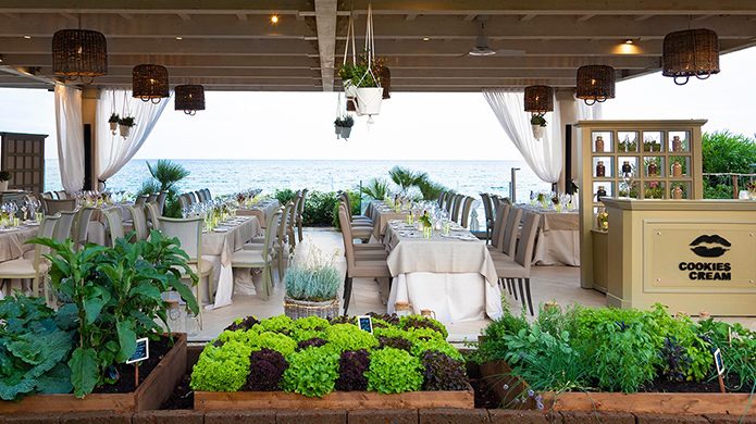 Forte Village Resorts Cookies Cream restaurant with open-air seating overlooking the ocean