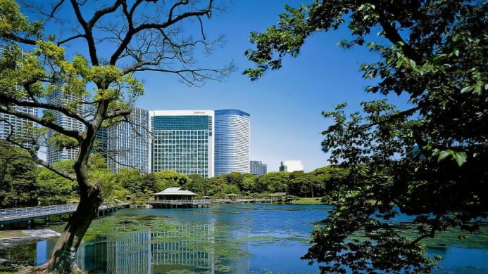 Conrad Tokyo exterior view with gardens and lake