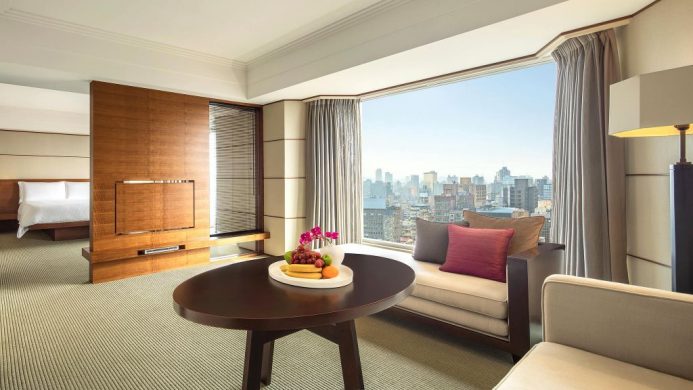 Regent Taipei Junior Suite with floor-to-ceiling window overlooking city