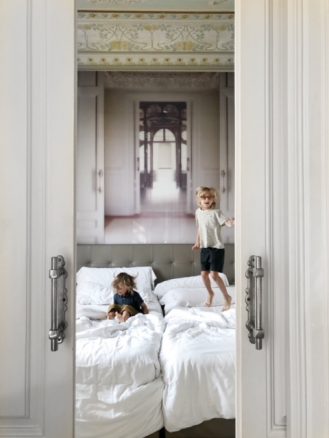 Kids jumping on the bed at El Palauet Barcelona