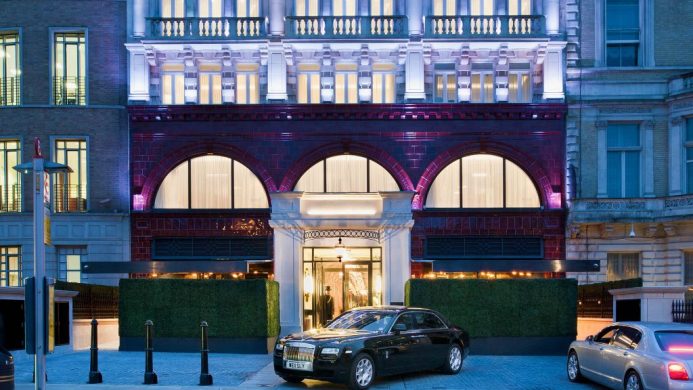 The Wellesley facade entrance with Rolls Royce and door man