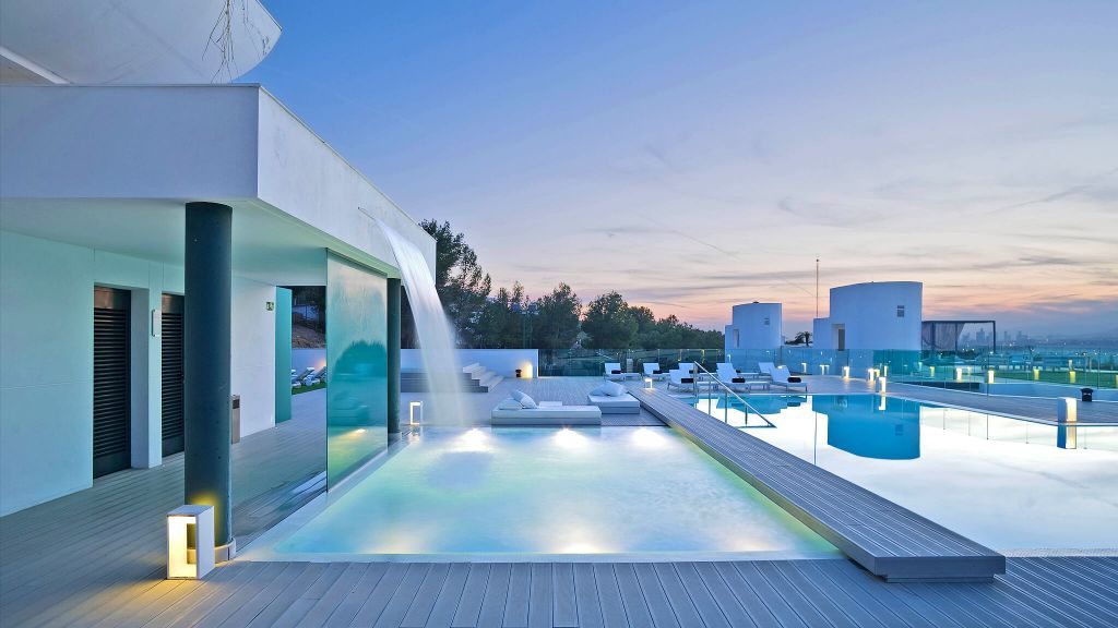 Infinity pool deck with waterfall