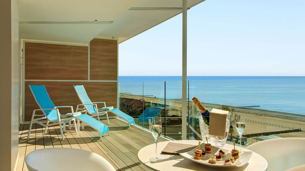Almar Jesolo Resort & Spa's Prestige Suite terrace with sparkling wine and ocean view