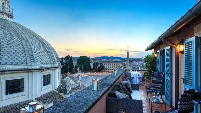 Terrace Suite at Hotel de Russie with a view of domed rooftops at sunset