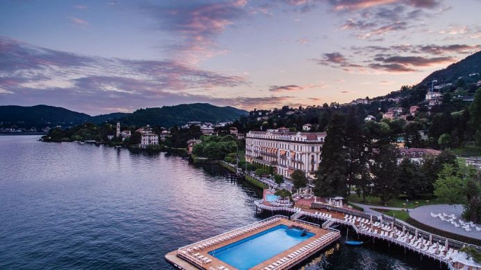 Aerial view of Villa d'Este, floating pool and lake at dusk