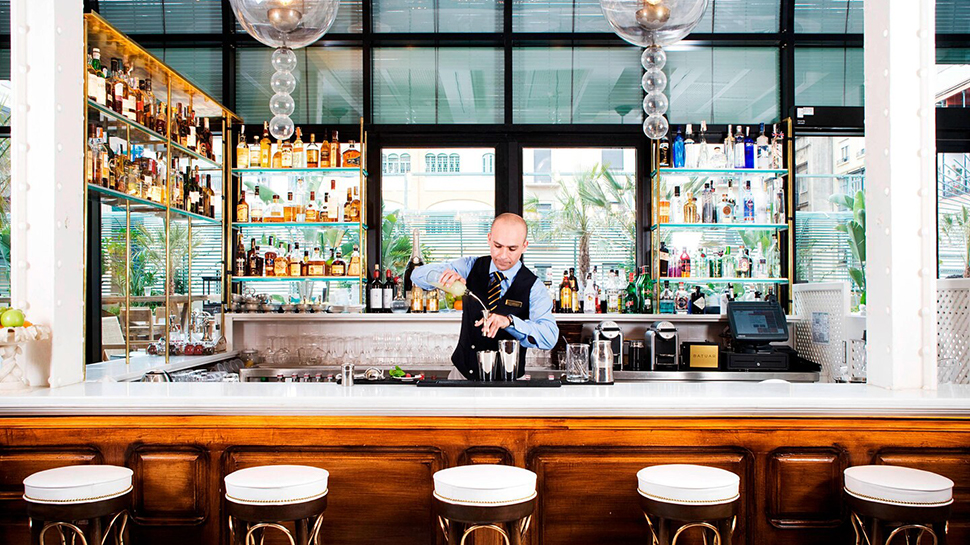 Bartender behind the Batuar Restaurant Bar