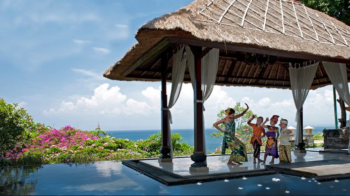 Kids dancing poolside in cultural costume at The Villas at AYANA Resort