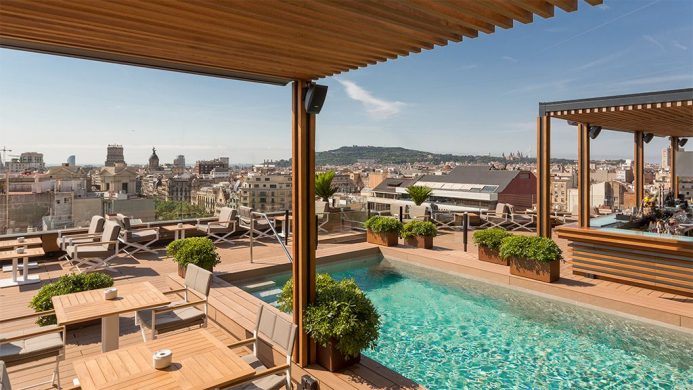 Rooftop terrace with pool at Majestic Hotel and Spa Barcelona