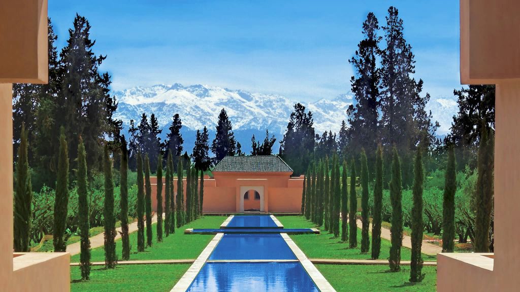 The Oberoi Marrakech view of grand canal and snowcapped mountains