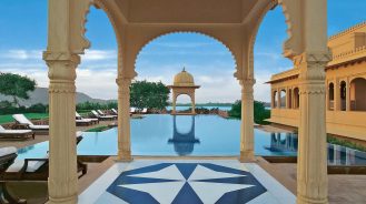 The Oberoi Udaivilas pool with traditional arches