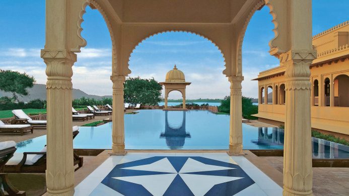 The Oberoi Udaivilas pool with traditional arches