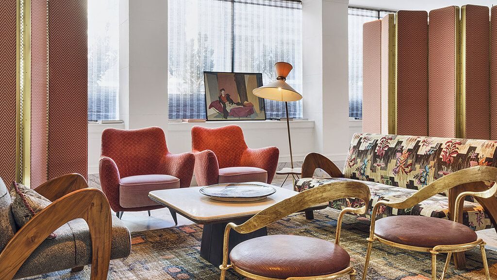 Sitting area with art and mid-century modern furniture at the San Francisco Proper hotel