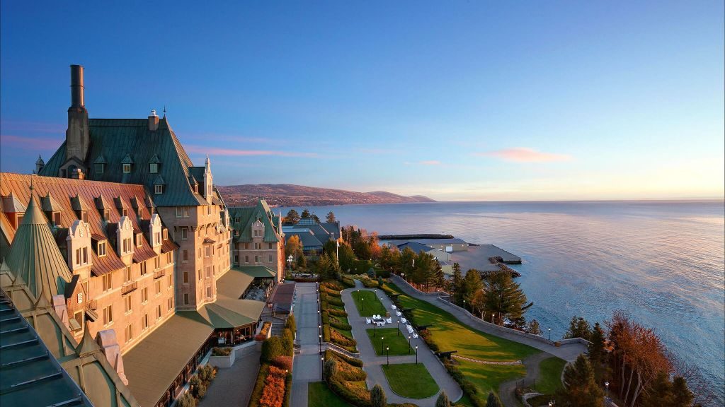 Exterior view of the Fairmont Le Manoir Richelieu and river