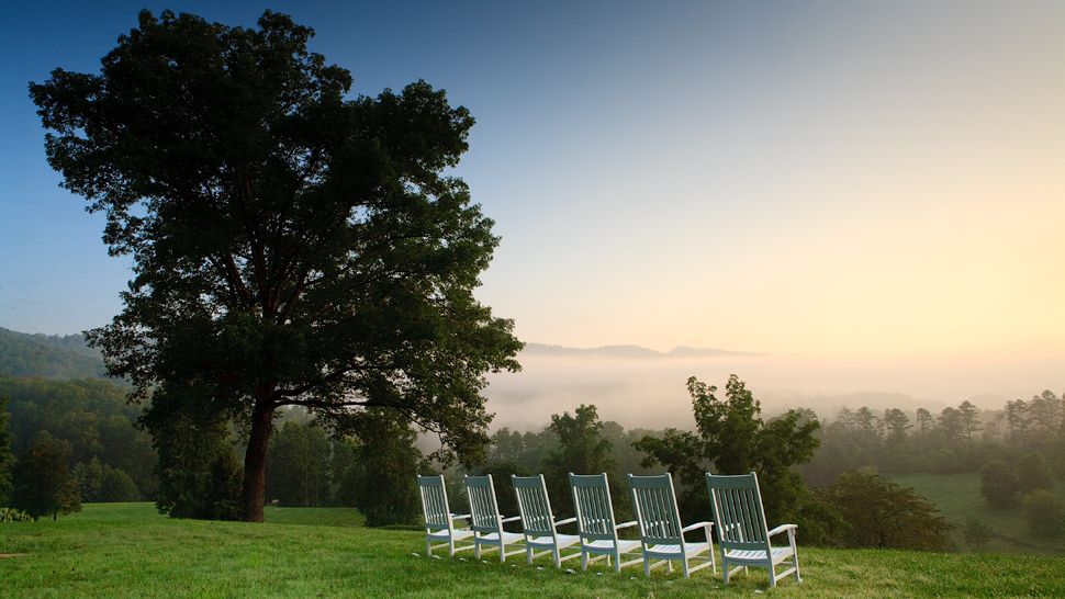 Lawn chairs looking out to smoky hills at Blackberry Farm
