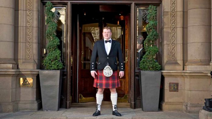 The Tartan Butler in front of The Balmoral