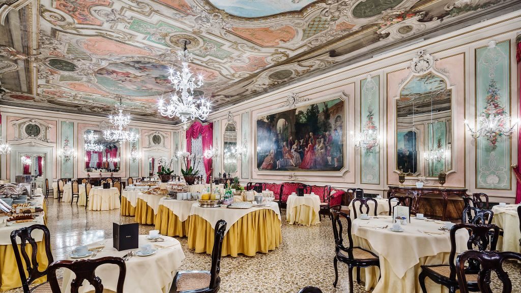Baglioni Hotel Luna's Marco Polo Room featuring oil paintings on the walls