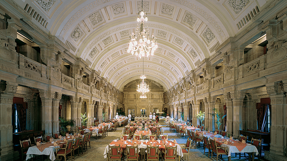 Umaid Bhawan Palace's large banquet hall under a chiselled vaulted ceiling