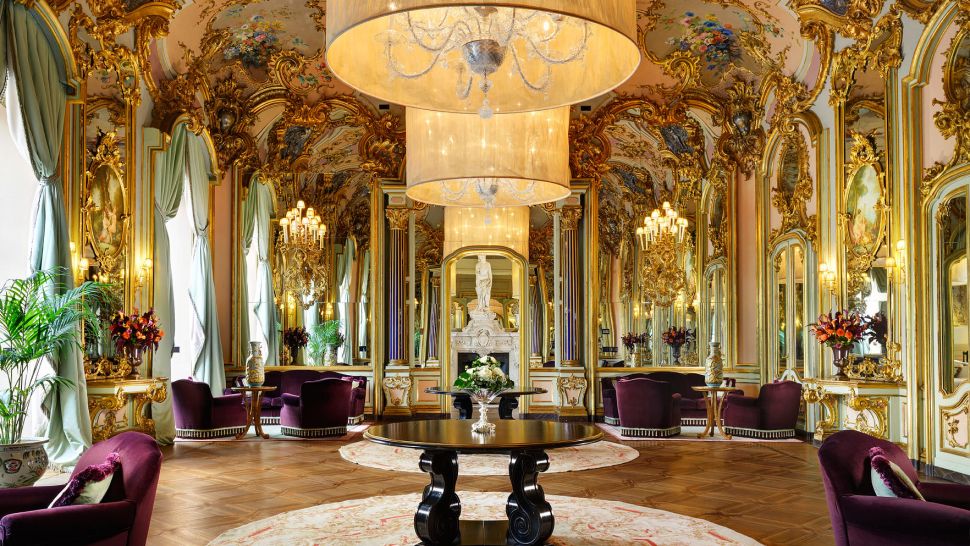 Villa Cora's Mirror Room with golden Baroque walls and ceilings