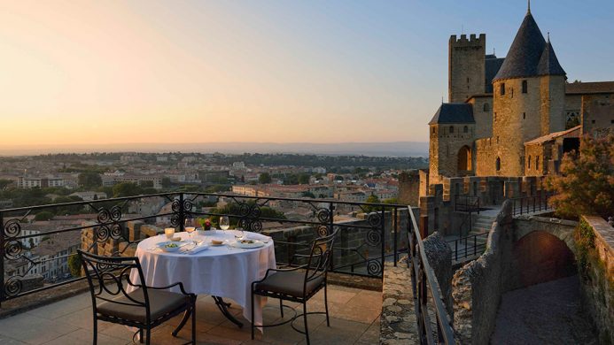 Hôtel de la Cité sunset dining overlooking castle walls