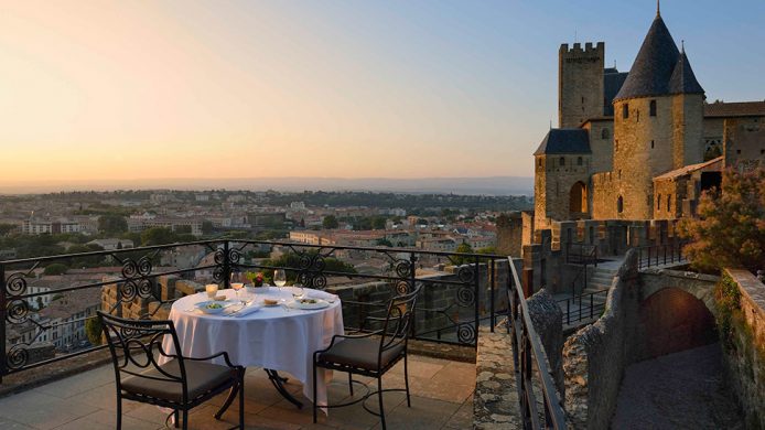 Hôtel de la Cité sunset dining overlooking castle walls