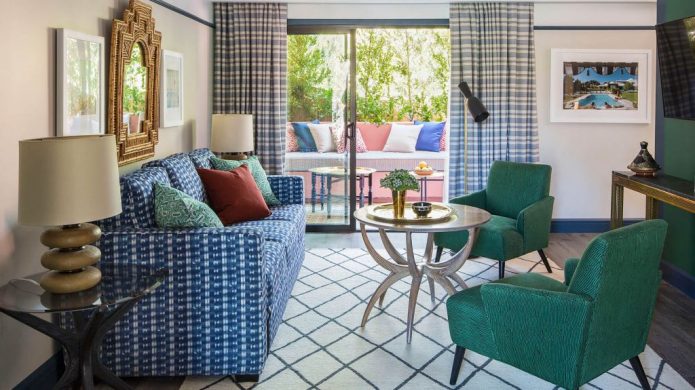 Sands Hotel & Spa suite livingroom with colorful furniture and a balcony