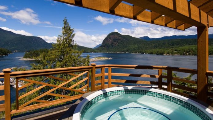 Sonora Resort's hot tub overlooking water and green land