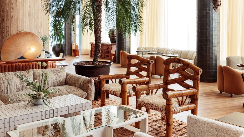 Santa Monica Proper Hotel's lobby and Palma lounge with white sofas and a palm tree