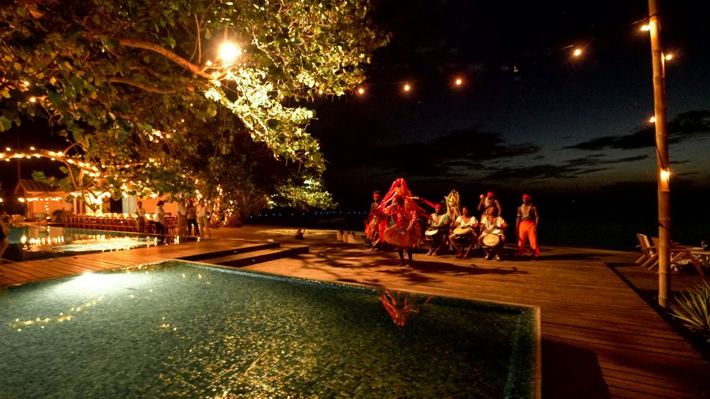 Garífuna dancing next to the pool at Ibagari Boutique Hotel