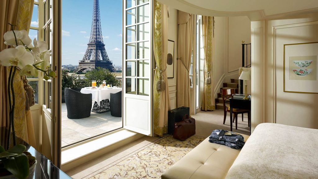 Shangri-La Paris' Duplex Terrace Room with French doors opening to a balcony view of the Eiffel Tower