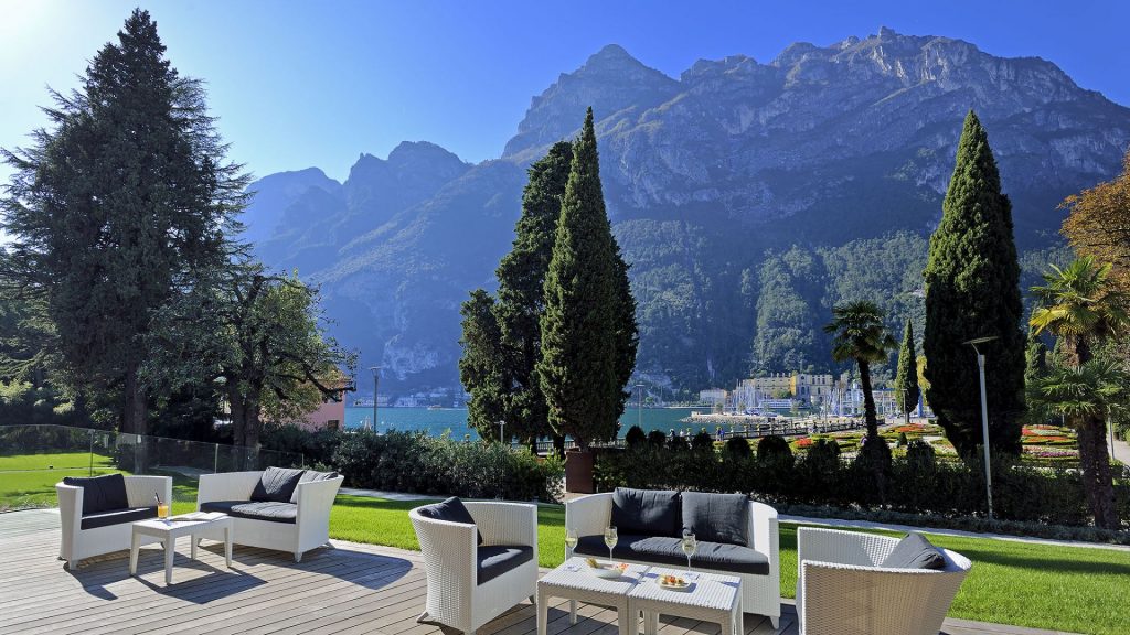 Lido Palace's outdoor terrace overlooking Lake Garda and mountains