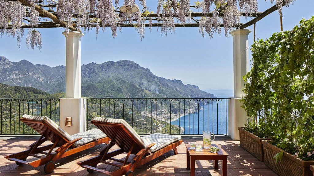 Palazzo Avino's terrace overlooking framed by blossoms and overlooking the Mediterranean